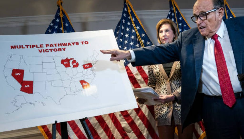 Rudy Giuliani points to a map as he speaks to the press about various lawsuits related to the 2020 election
